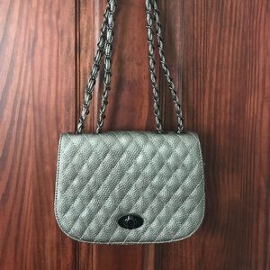 Moda Luxe quilted leather shoulder bag.